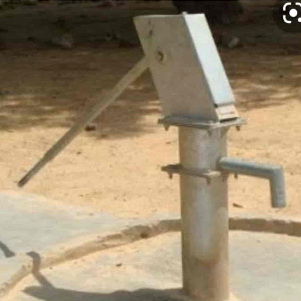 Community members using an IDWP pump